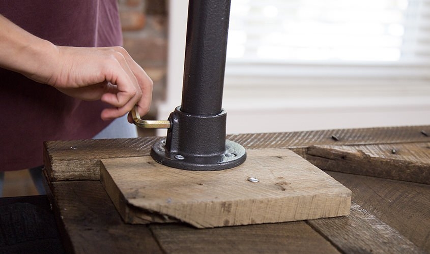 woman using allen key to tighten desk legs