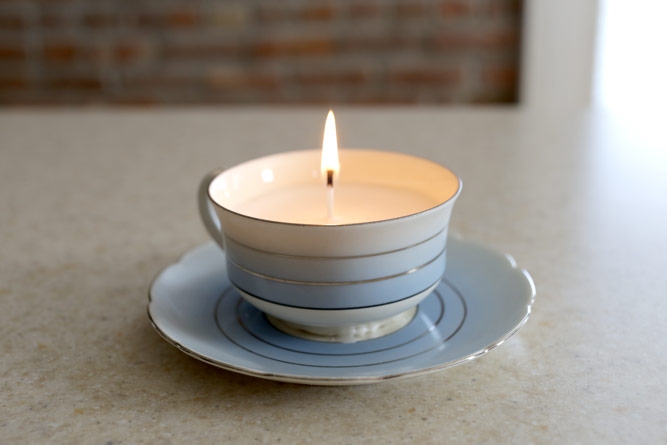 old teacup that has been turned into a candle