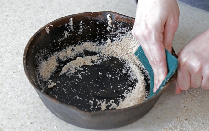 cleaning a cast iron pan with course salt