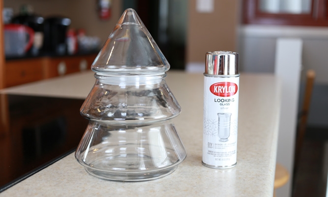 glassware in the shape of a christmas tree sitting next to a can of mirror paint