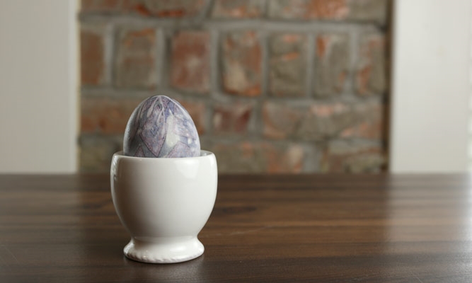 purple dyed egg in holder