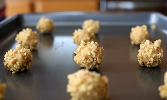 uncooked cookies on a baking sheet