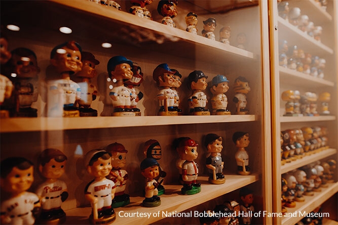 display case filled with baseball bobbleheads