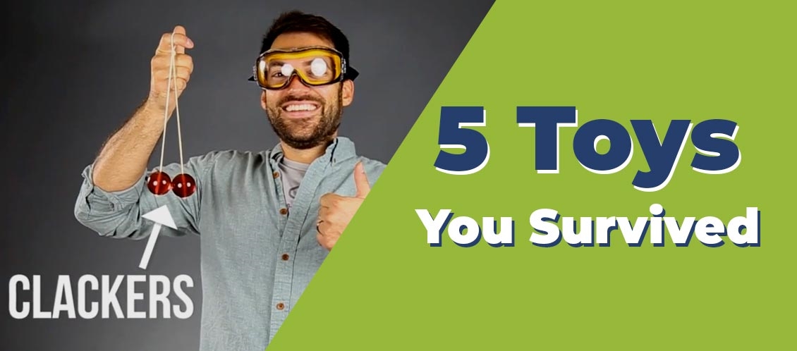 man holding old dangerous clacker toy