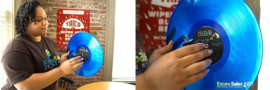 woman placing clock mechanism into center hold of record